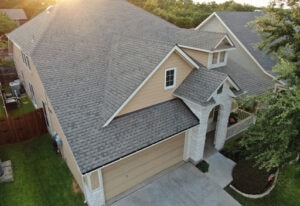 Aerial view of Texas residential home with gray shingle roof